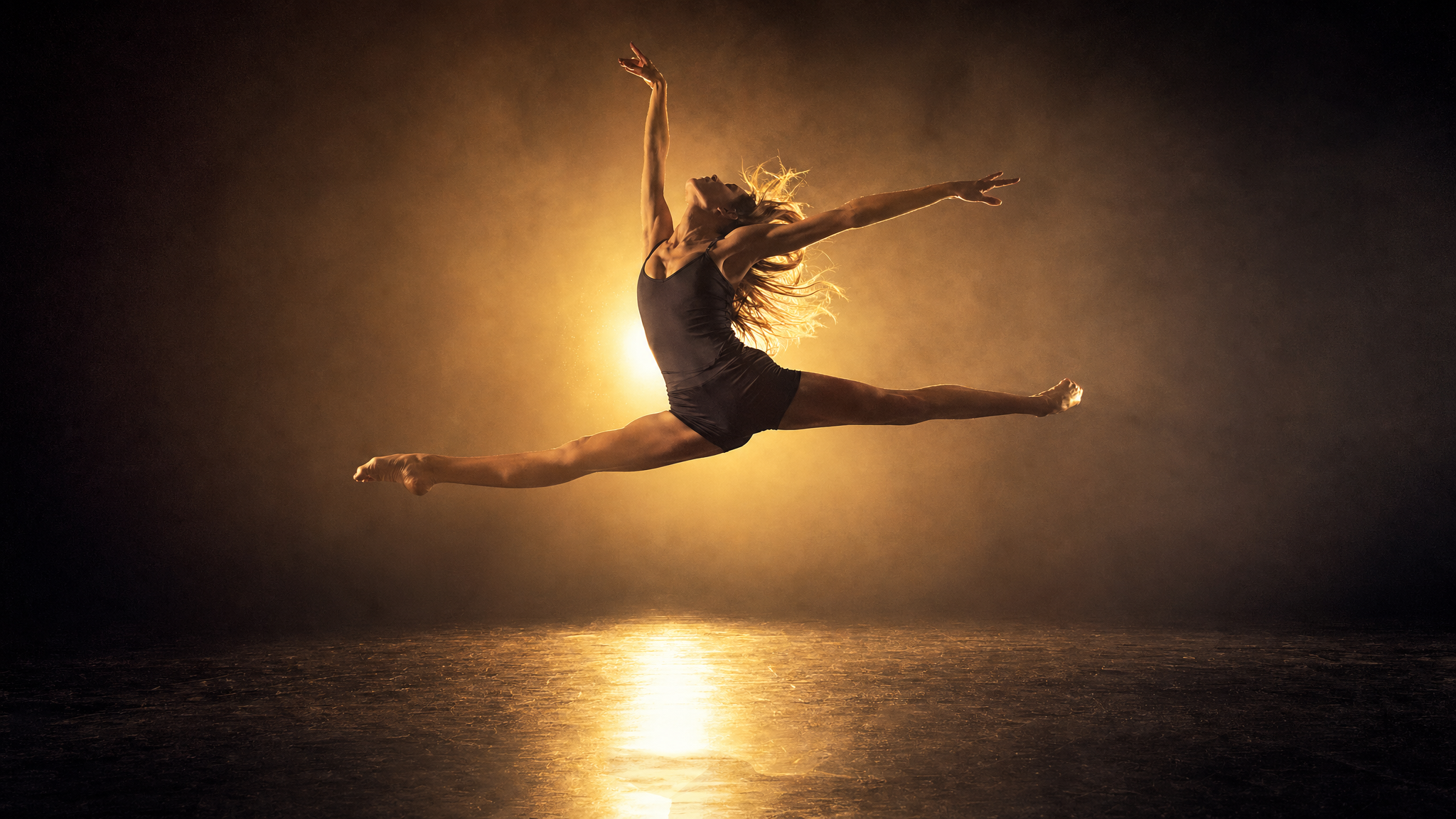 Dancer mid-leap representing all disciplines